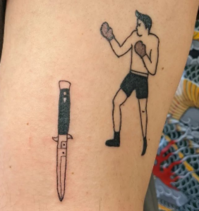 dagger and a boxer tattoo